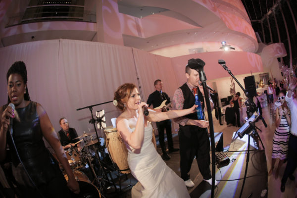Bride signing with the live band