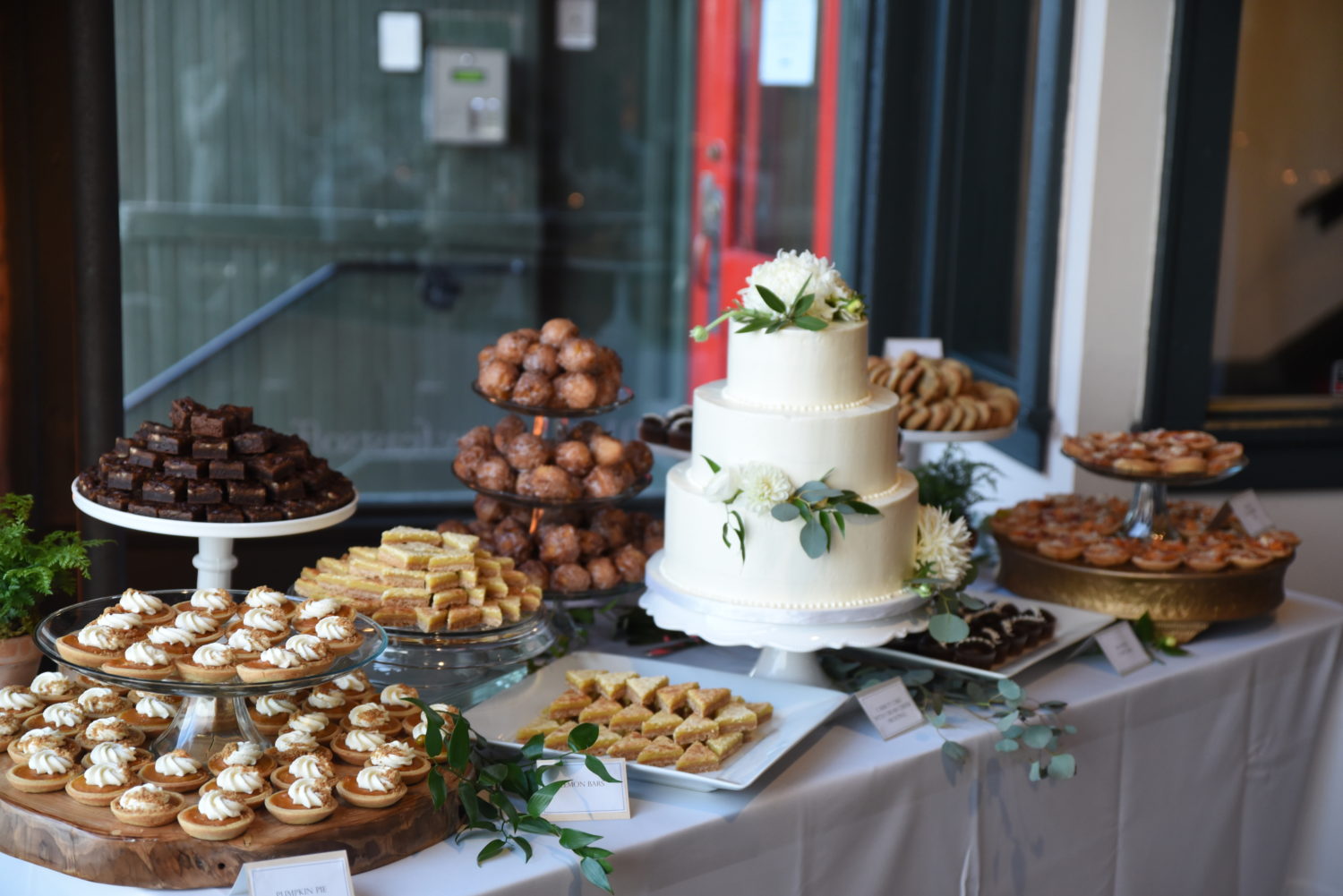 cake table with mixed desserts