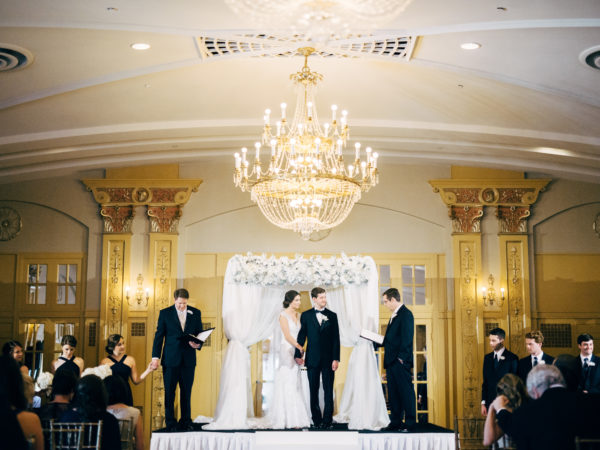 white chuppah ballroom ceremony